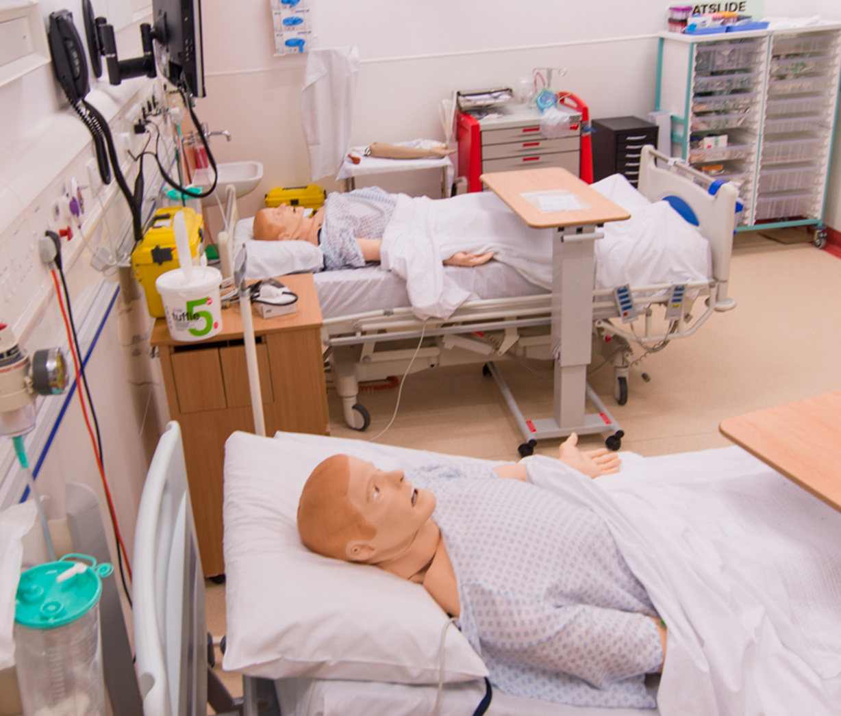 Simulation mannequins in bed in the simulation lab