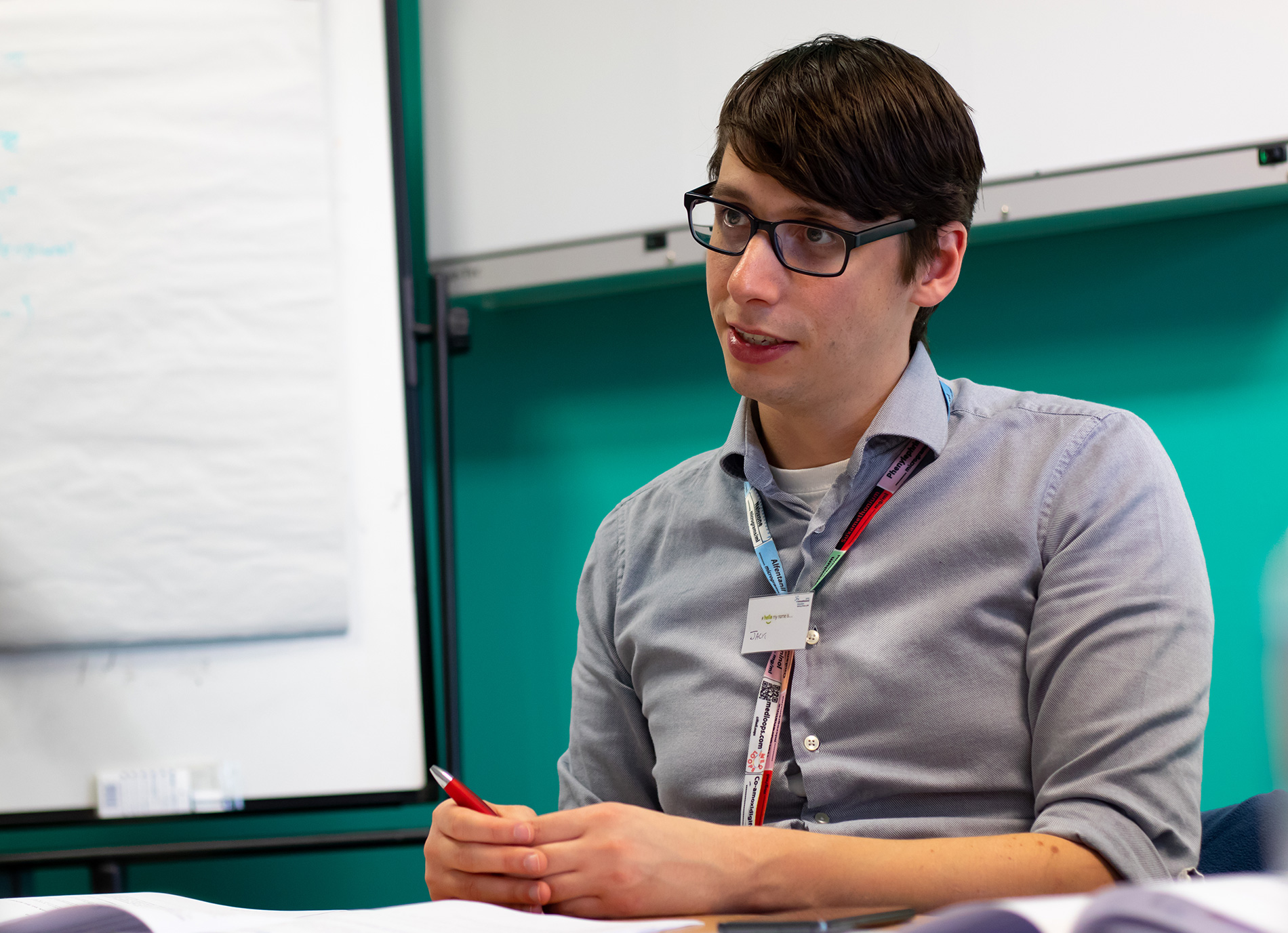 This is a photograph showing a doctor in a seminar room